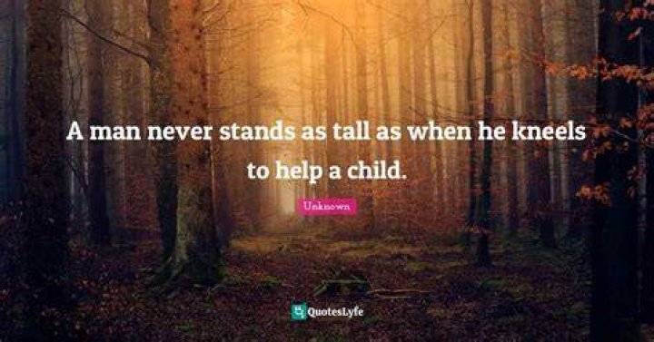A man never stands as tall as when he kneels to help his child