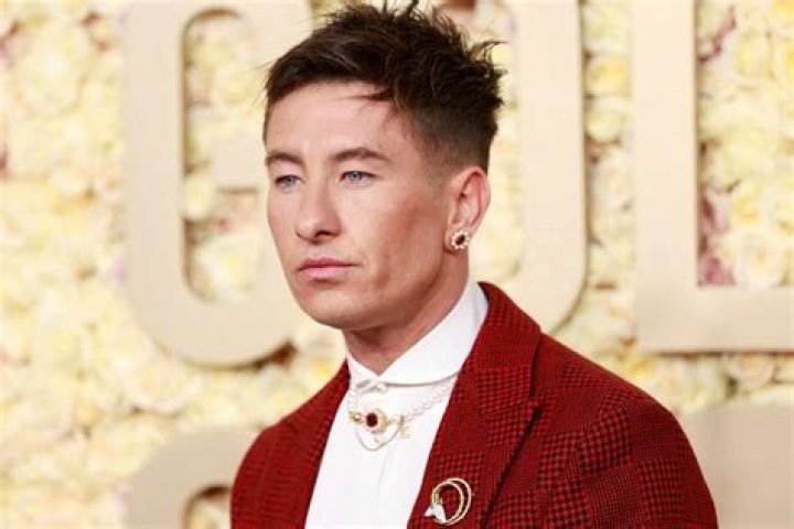 Barry Keoghan Attends 2024 Golden Globes in Dashing Red Suit and Pearl