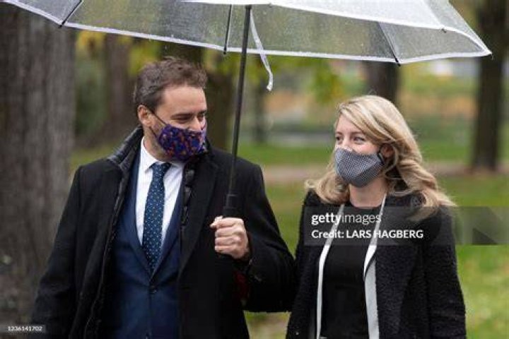 Melanie Joly, and her husband, Felix Marzell, arrive for the